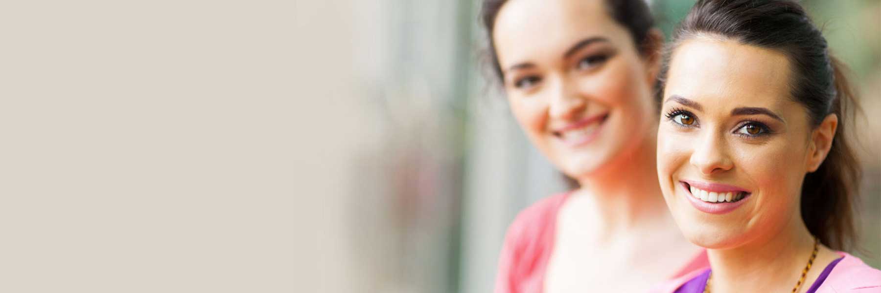 Patients smiling at cosmetic dental appointment 