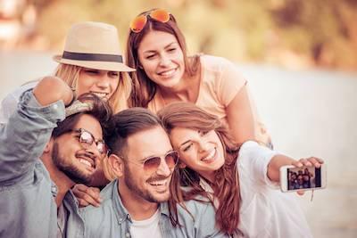 Friends taking a selfie after getting a dental implant at CS Family Dentistry, Bastrop, TX