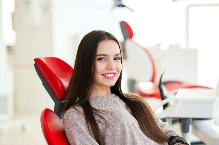 A patient waiting for a Professional Teeth Whitening procedure in Bastrop, TX