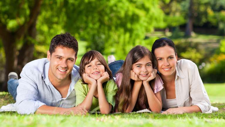 A family poses after visiting CS Family Dentistry in Bastrop, TX