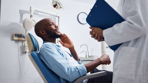 Patient in a dental chair at an endodontic specialist office.