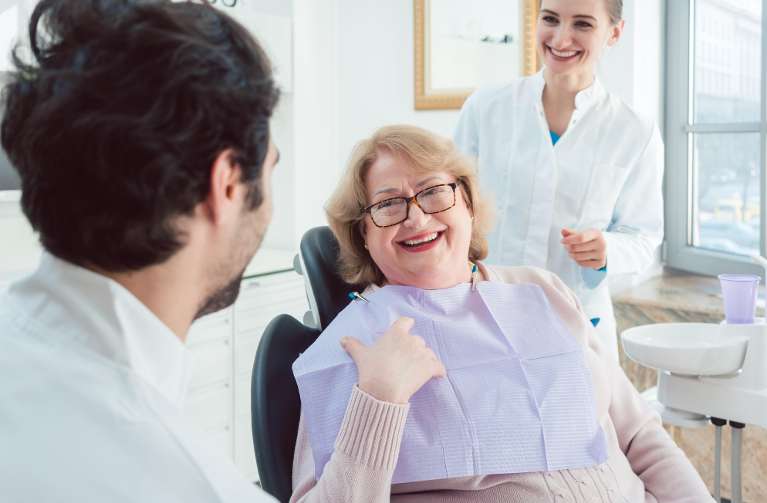 an elderly lady getting ready for a Dental exam in Bastrop tx