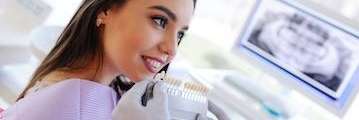 A lady undergoing teeth whitening in Bastrop, TX