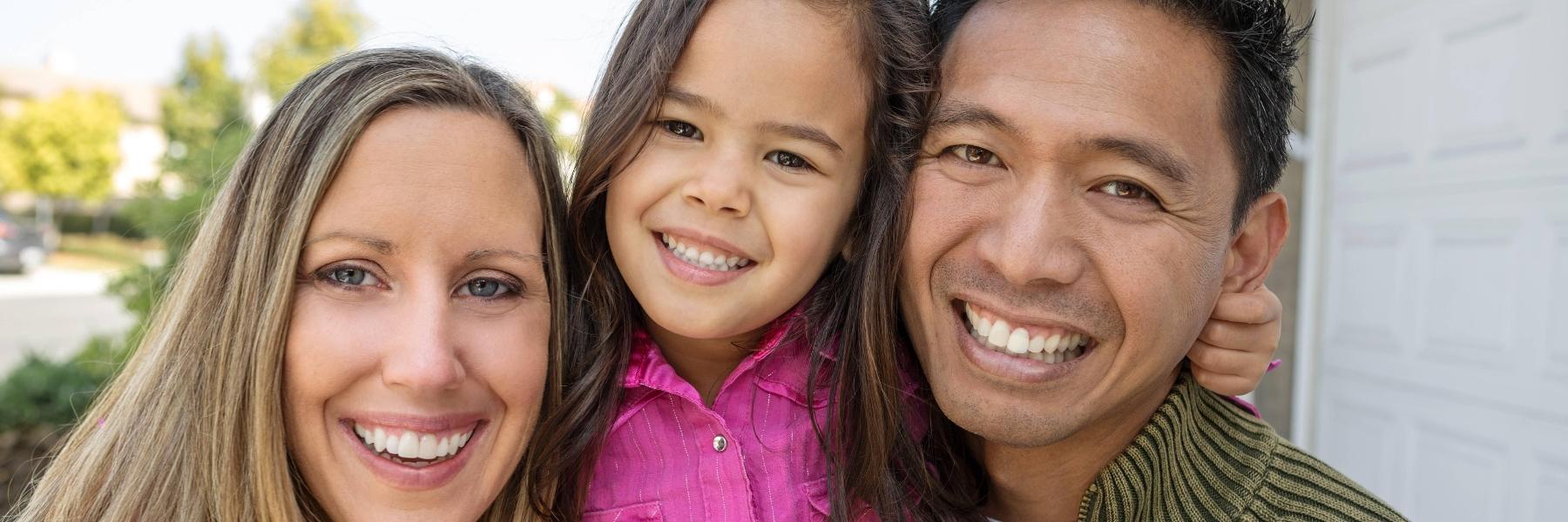 A family smiling after teeth whitening at CS Family Dentistry